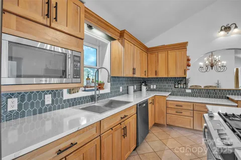 a kitchen with a sink cabinets and window