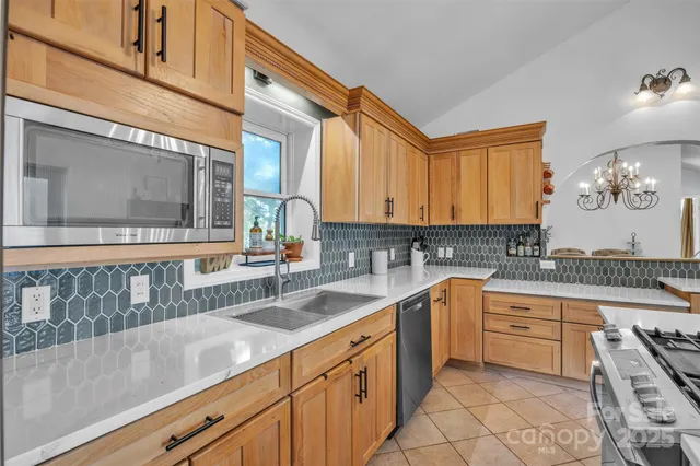 a kitchen with a sink cabinets and window
