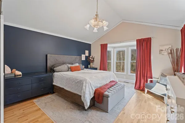 a view of a livingroom with furniture and a window