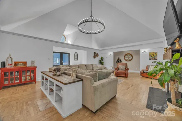 a living room with furniture potted plant and a ceiling fan