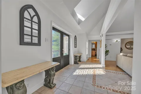 a bathroom with a granite countertop toilet and a sink