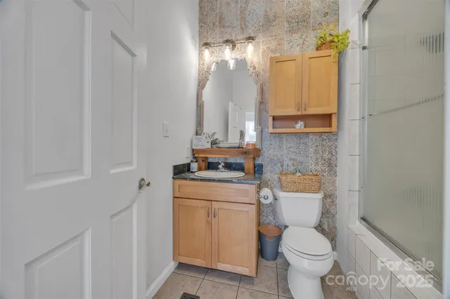 a bed room with a bed and a window