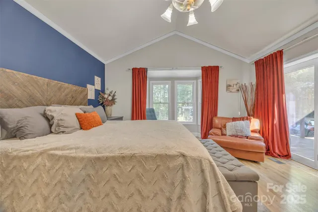 a bathroom with a sink a toilet a mirror and shower