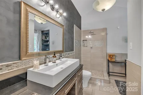 a bathroom with a bathtub and a shower