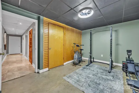 a view of a patio with table and chairs and potted plants