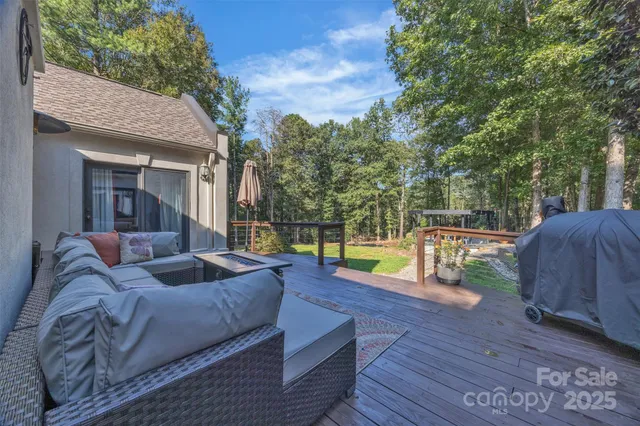 a view of a couches in patio of back yard