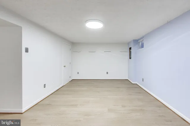 a view of an empty room and window