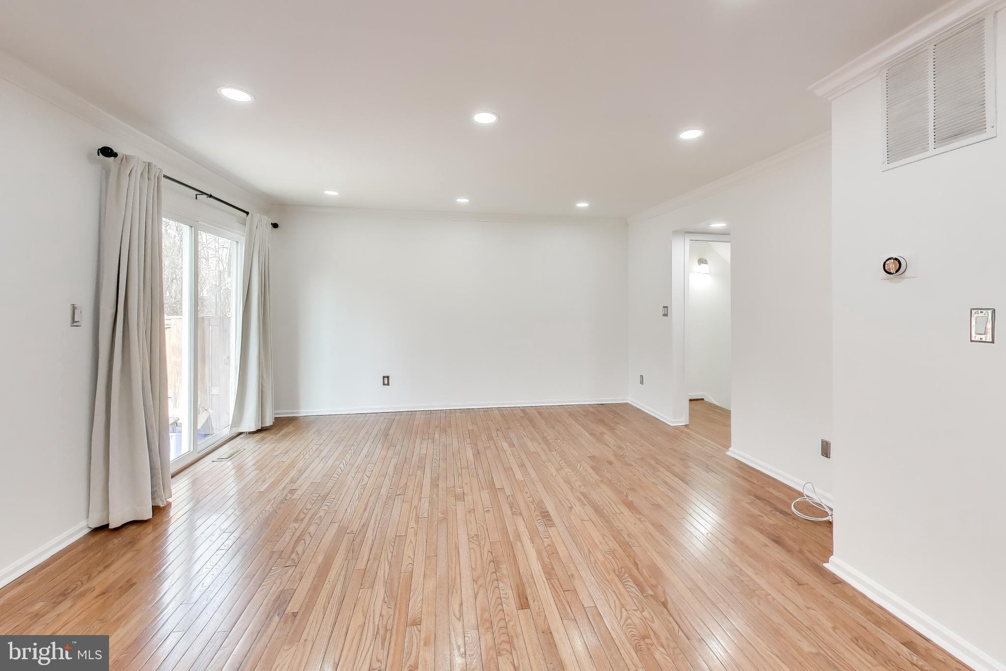 20210 Maple Leaf Court Gaithersburg, MD 20886 - Photo 20 of 31 wooden floor in an empty room with a window