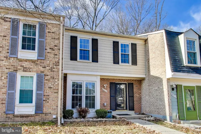 a front view of a house with glass windows