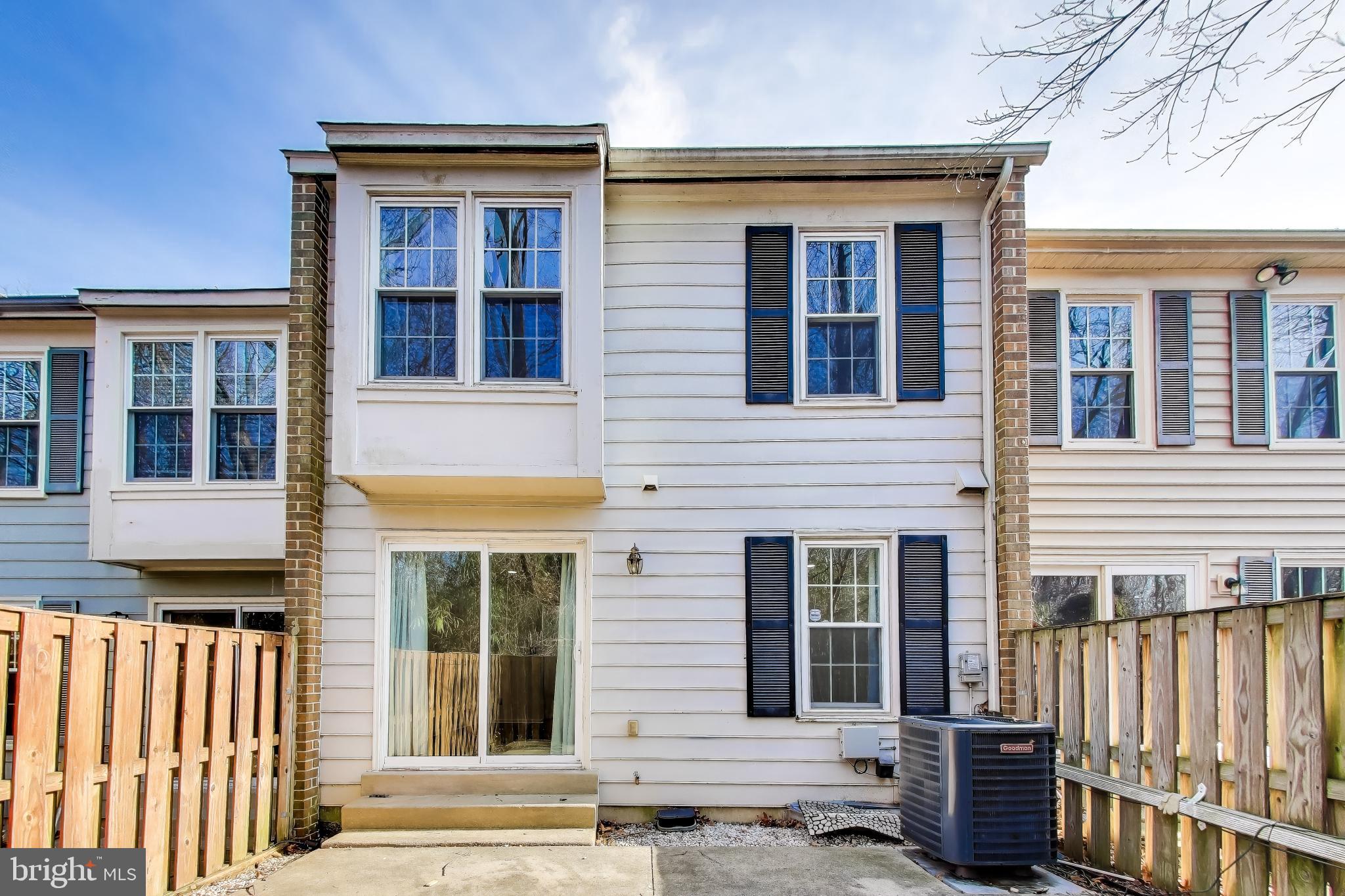 20210 Maple Leaf Court Gaithersburg, MD 20886 - Photo 27 of 31 a front view of a house with glass windows