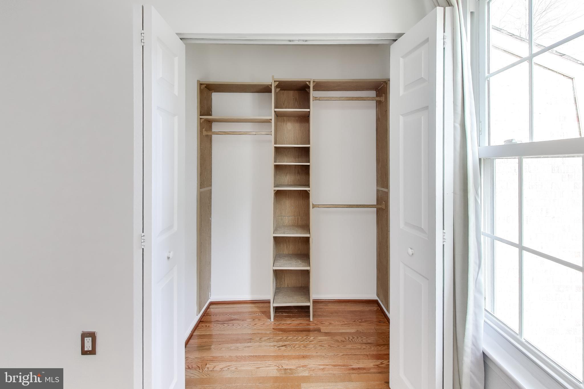 20210 Maple Leaf Court Gaithersburg, MD 20886 - Photo 29 of 31 a view of an empty room with wooden floor and a window