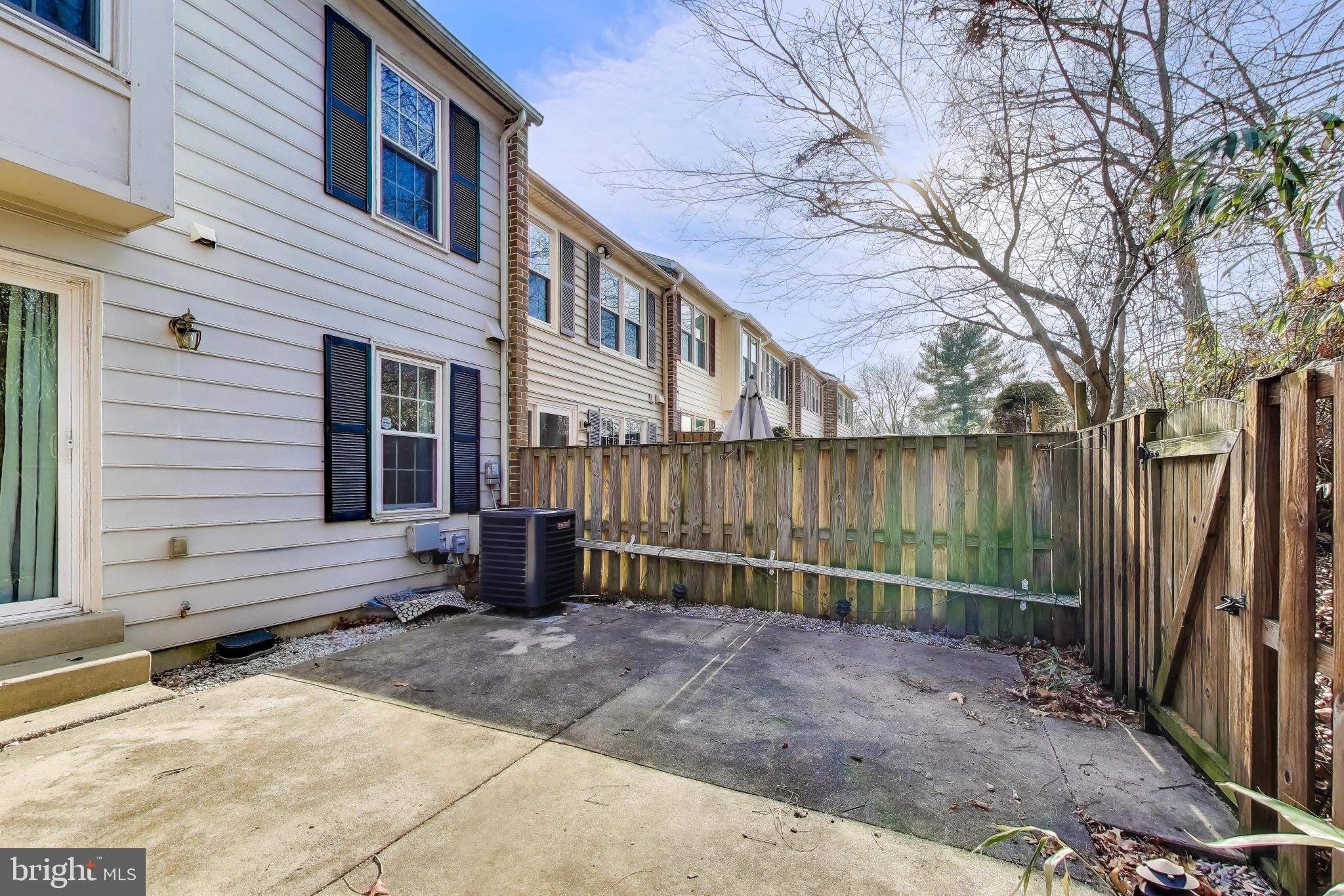20210 Maple Leaf Court Gaithersburg, MD 20886 - Photo 30 of 31 a view of a house with backyard and wooden fence