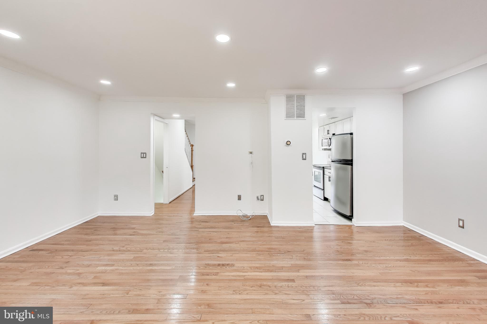 20210 Maple Leaf Court Gaithersburg, MD 20886 - Photo 4 of 31 a view of empty room with wooden floor