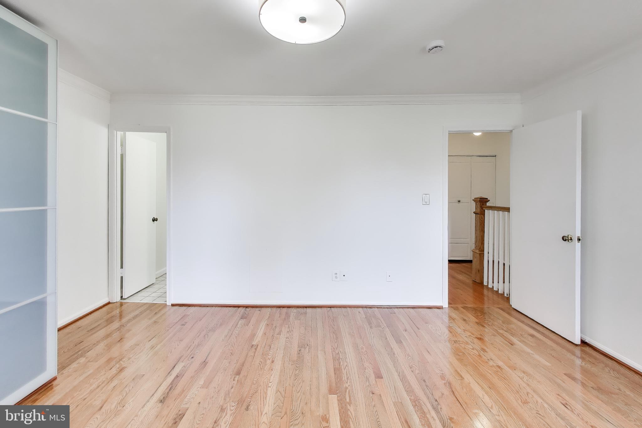 20210 Maple Leaf Court Gaithersburg, MD 20886 - Photo 9 of 31 wooden floor in an empty room