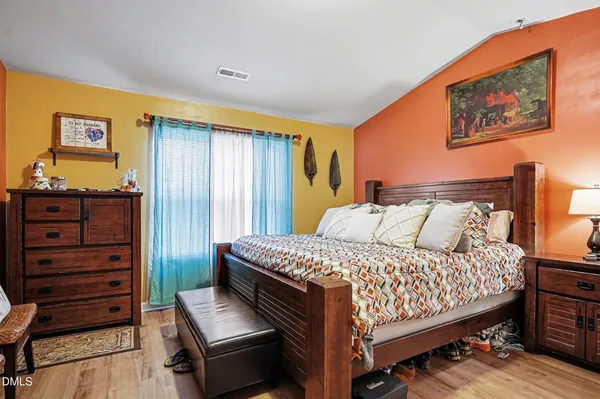 a bedroom with a bed and furniture