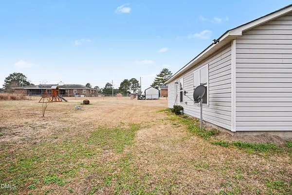 a view of a backyard of the house