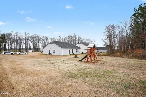 a view of outdoor space with playground and tree