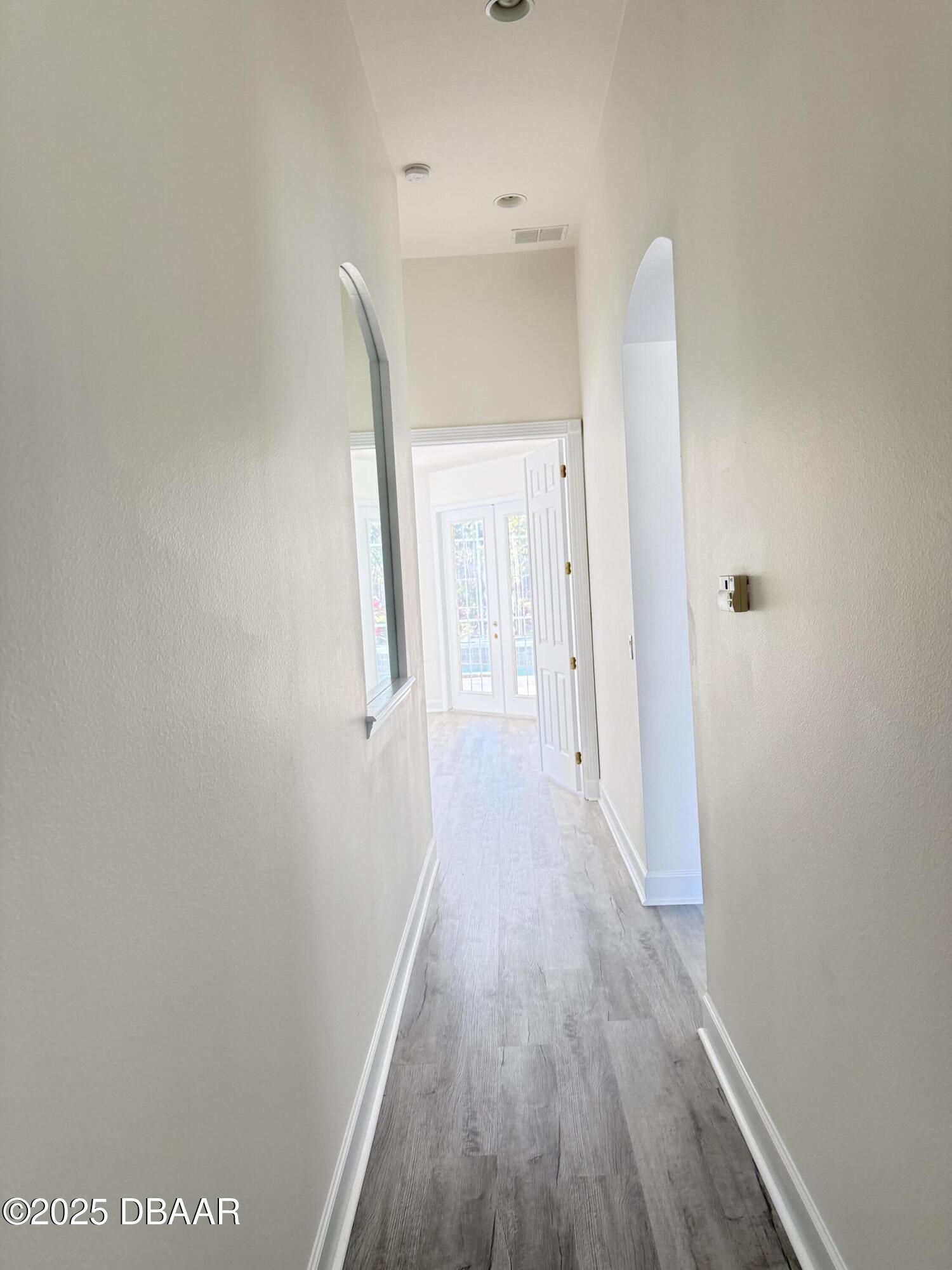 14 Deep Woods Way Ormond Beach, FL 32174 - Photo 11 of 38 a view of a room with wooden floor