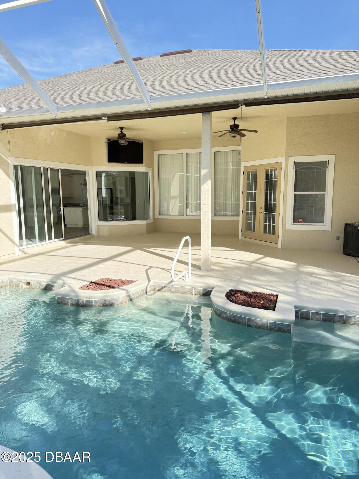 14 Deep Woods Way Ormond Beach, FL 32174 - Photo 29 of 38 a backyard of a house with yard and outdoor seating