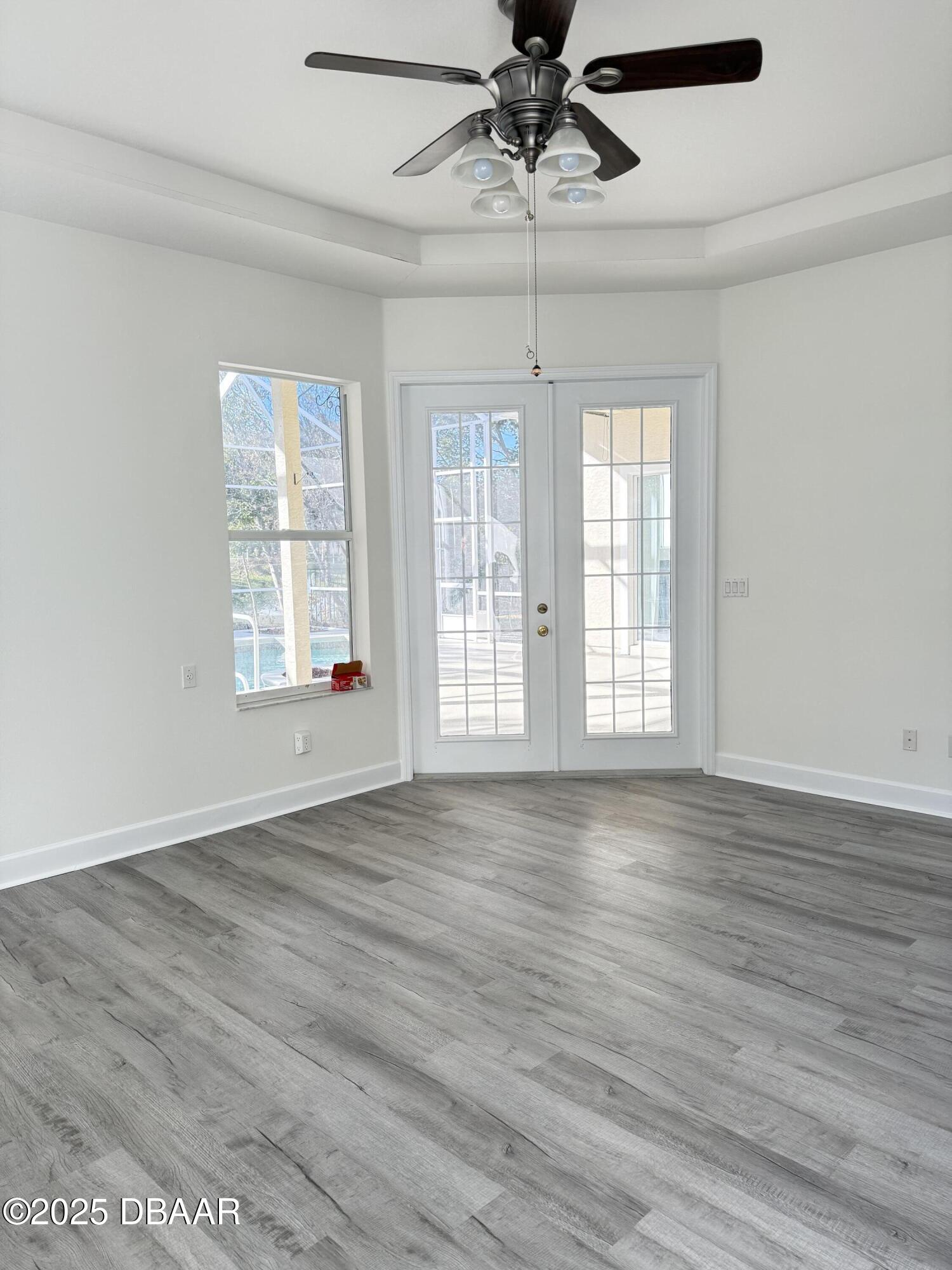 14 Deep Woods Way Ormond Beach, FL 32174 - Photo 5 of 38 a view of an empty room with wooden floor and a window
