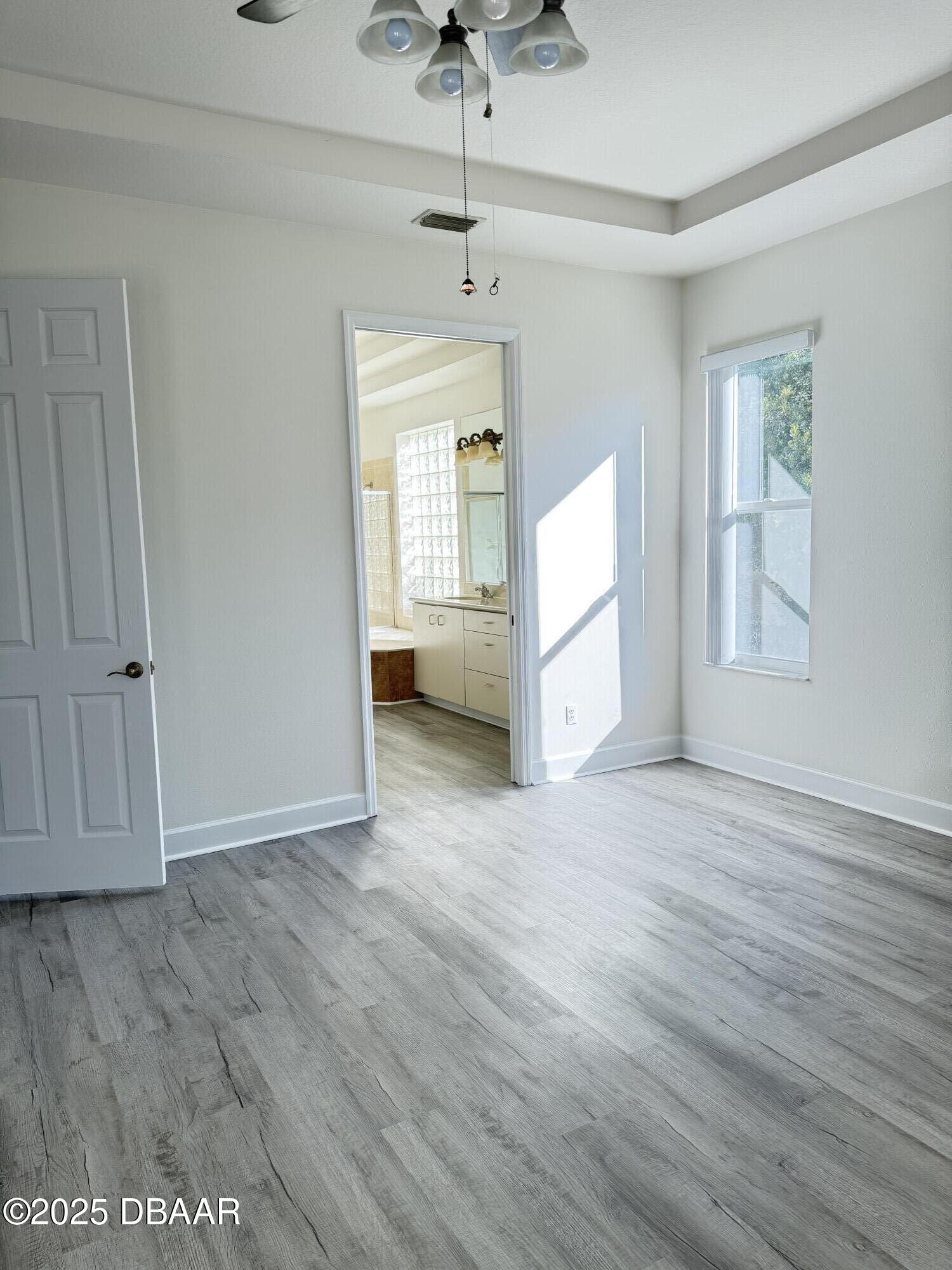 14 Deep Woods Way Ormond Beach, FL 32174 - Photo 7 of 38 a view of empty room with wooden floor and fan