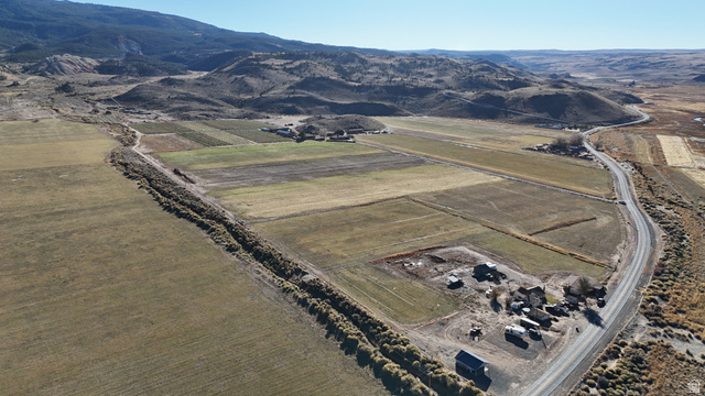 890 East Hatchery Road Bicknell, UT 84715 - Photo 33 of 48 Aerial overview of property's location featuring rural landscape, abundant farmland, and a mountain backdrop