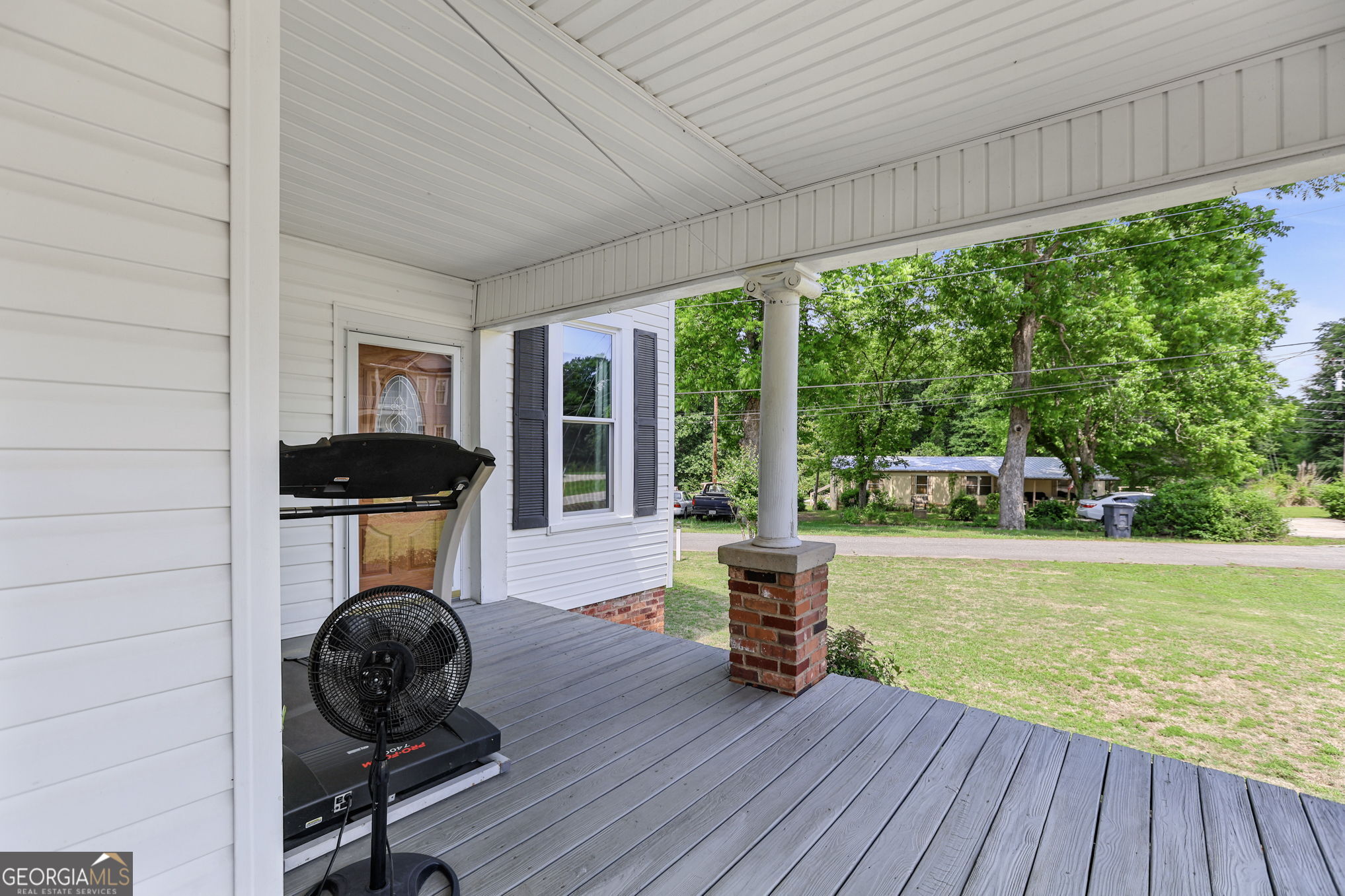 1205 Terrell Street Greenville, GA 30222 - Photo 39 of 50 a living room with furniture and a floor to ceiling window
