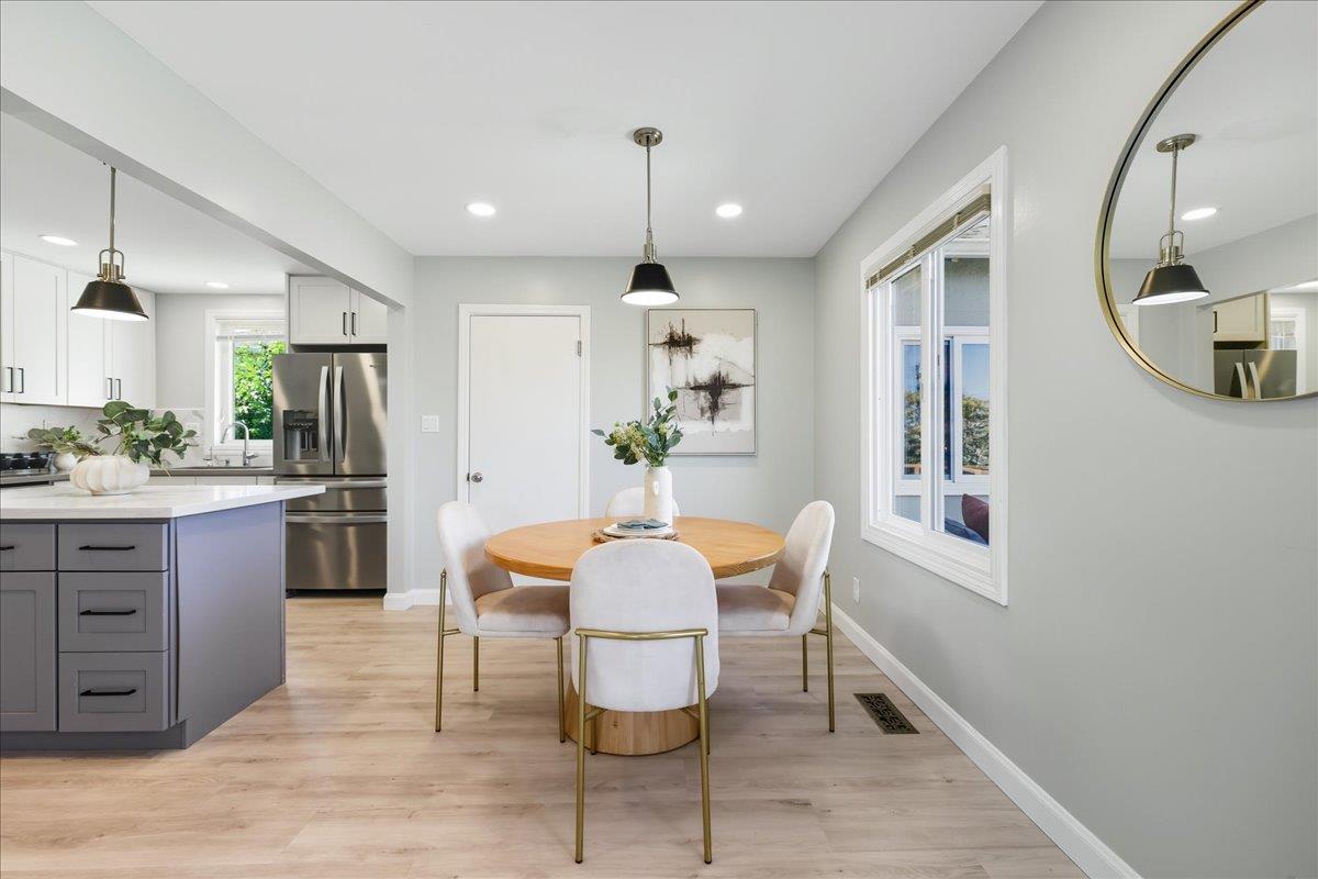18 Culver Court San Mateo, CA 94403 - Photo 13 of 71 a view of kitchen with kitchen island dining table and stainless steel appliances