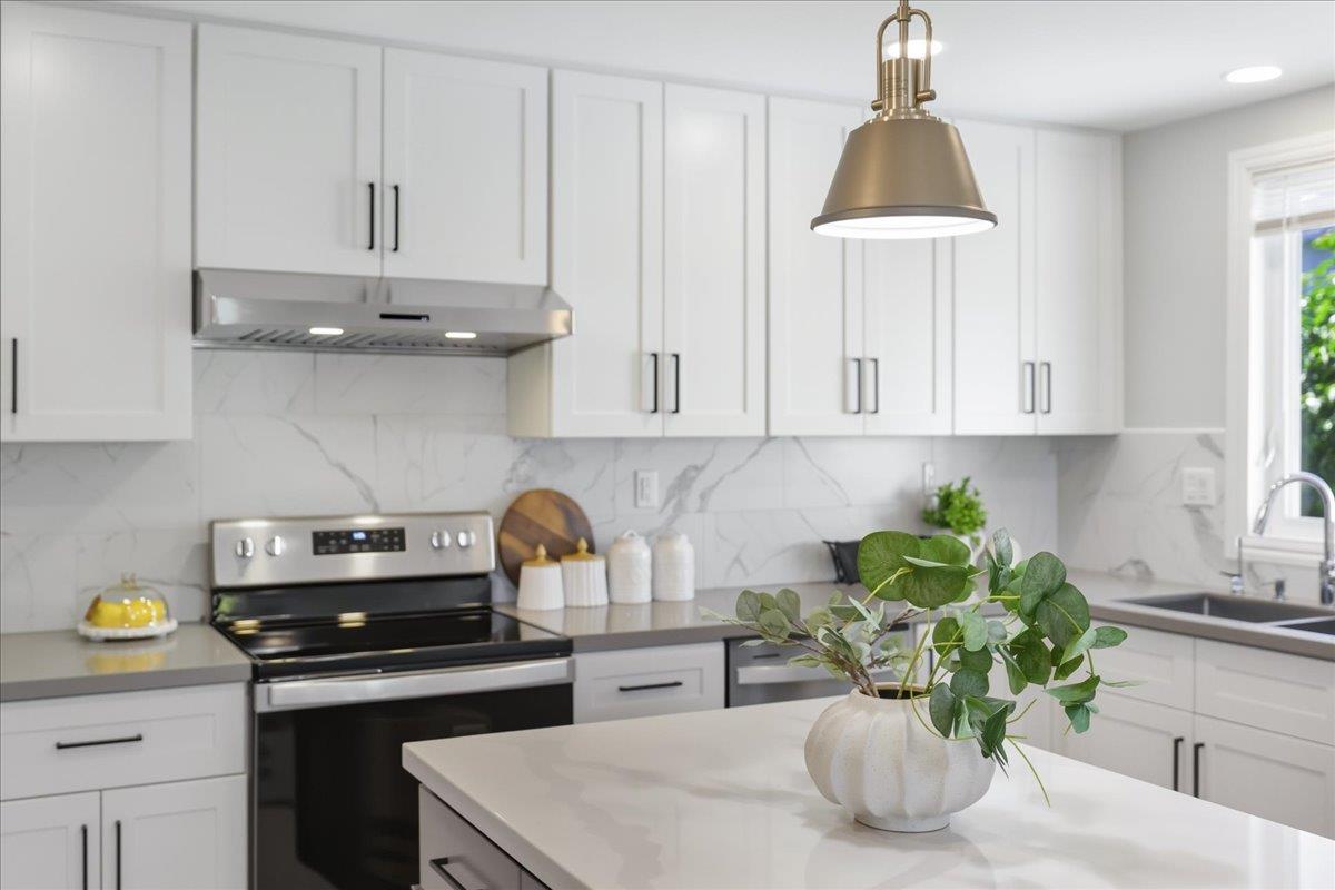 18 Culver Court San Mateo, CA 94403 - Photo 37 of 71 a kitchen with a sink a stove and cabinets