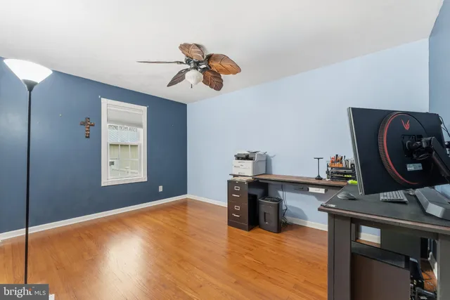 a view of room with window and wooden floor