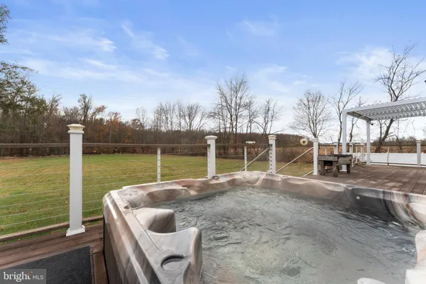 a view of a backyard with sitting area