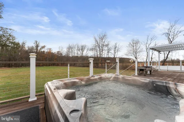 a view of a backyard with sitting area