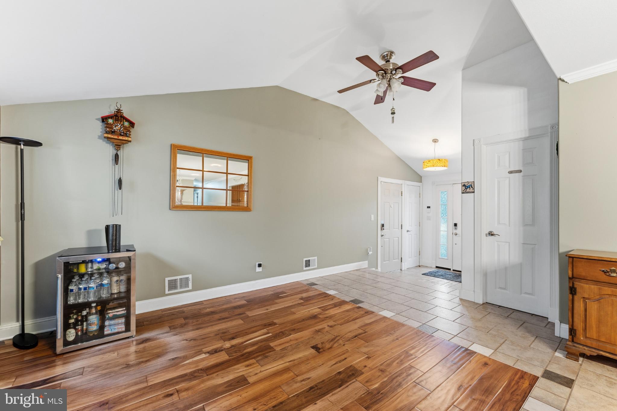 332 Gordon Road Robbinsville, NJ 08691 - Photo 7 of 47 a view of a livingroom with wooden floor and a ceiling fan