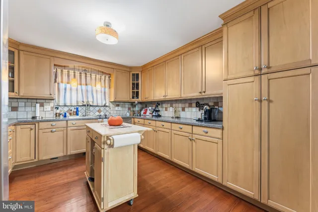 a kitchen with appliances cabinets and a sink