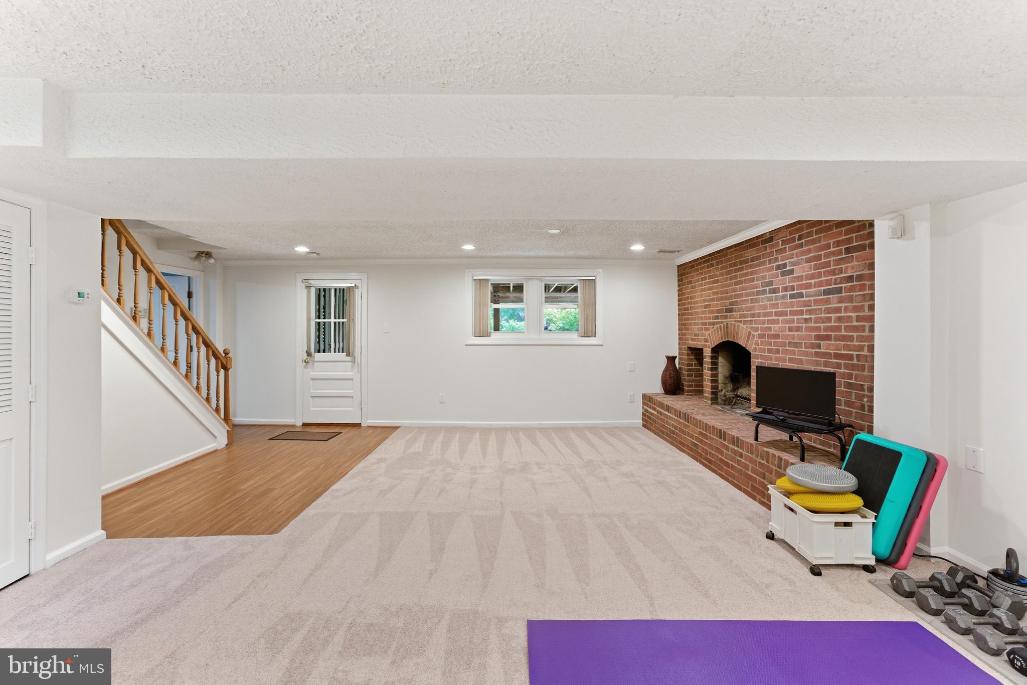 2100 Edgewater Parkway Silver Spring, MD 20903 - Photo 35 of 46 a living room with furniture and a fireplace