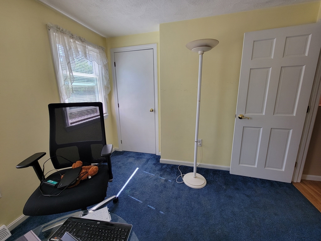 75 Brown Street Tewksbury, MA 01876 - Photo 19 of 28 a view of workspace with wooden floor windows