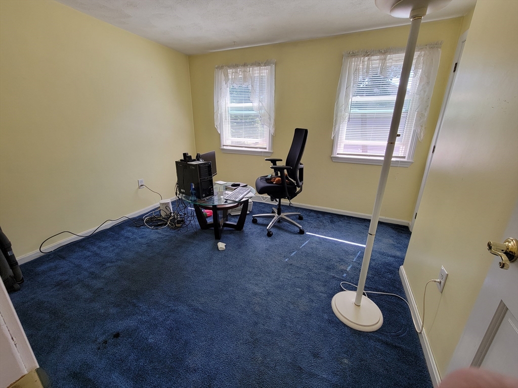 75 Brown Street Tewksbury, MA 01876 - Photo 20 of 28 a view of a workspace with furniture and a window