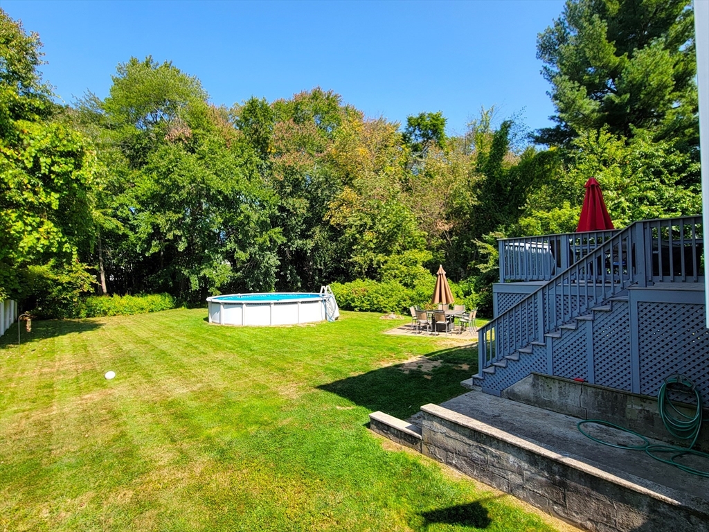 75 Brown Street Tewksbury, MA 01876 - Photo 23 of 28 a view of a backyard with swimming pool