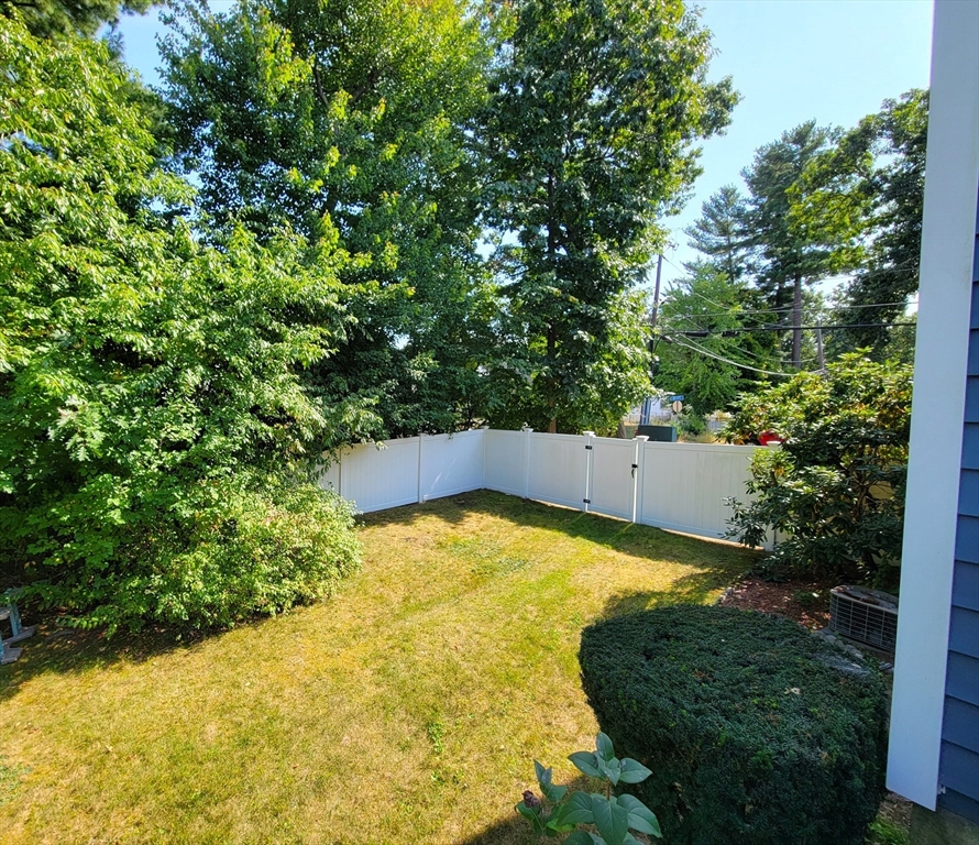 75 Brown Street Tewksbury, MA 01876 - Photo 25 of 28 a view of yard with swimming pool and trees