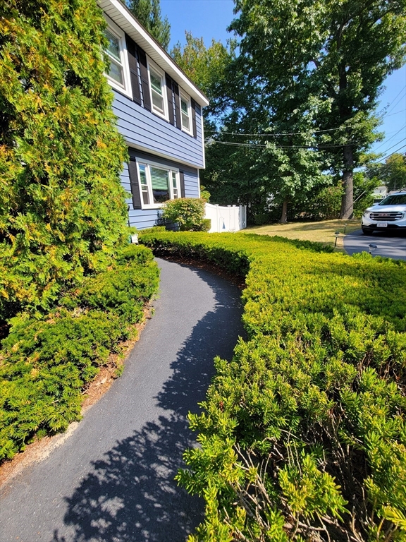 75 Brown Street Tewksbury, MA 01876 - Photo 26 of 28 a view of a house with a yard and sitting area