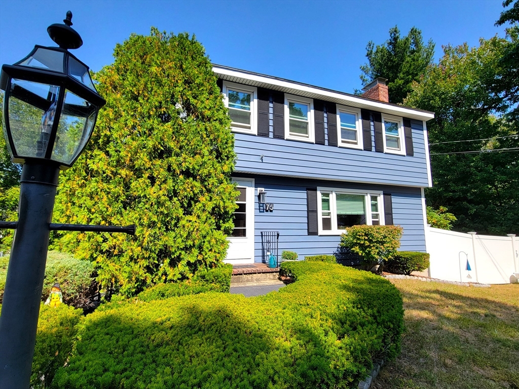 75 Brown Street Tewksbury, MA 01876 - Photo 27 of 28 a front view of a house with garden