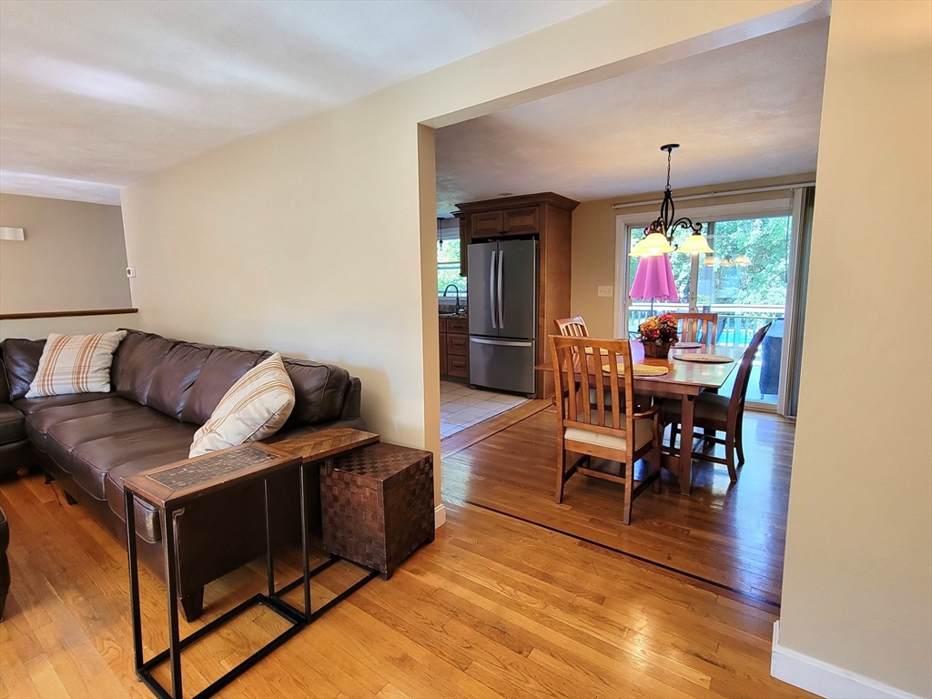 75 Brown Street Tewksbury, MA 01876 - Photo 10 of 28 a living room with furniture and a fireplace