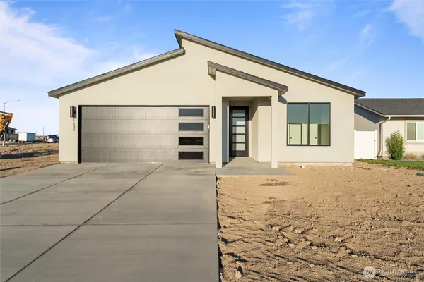 a front view of a house with a outdoor space