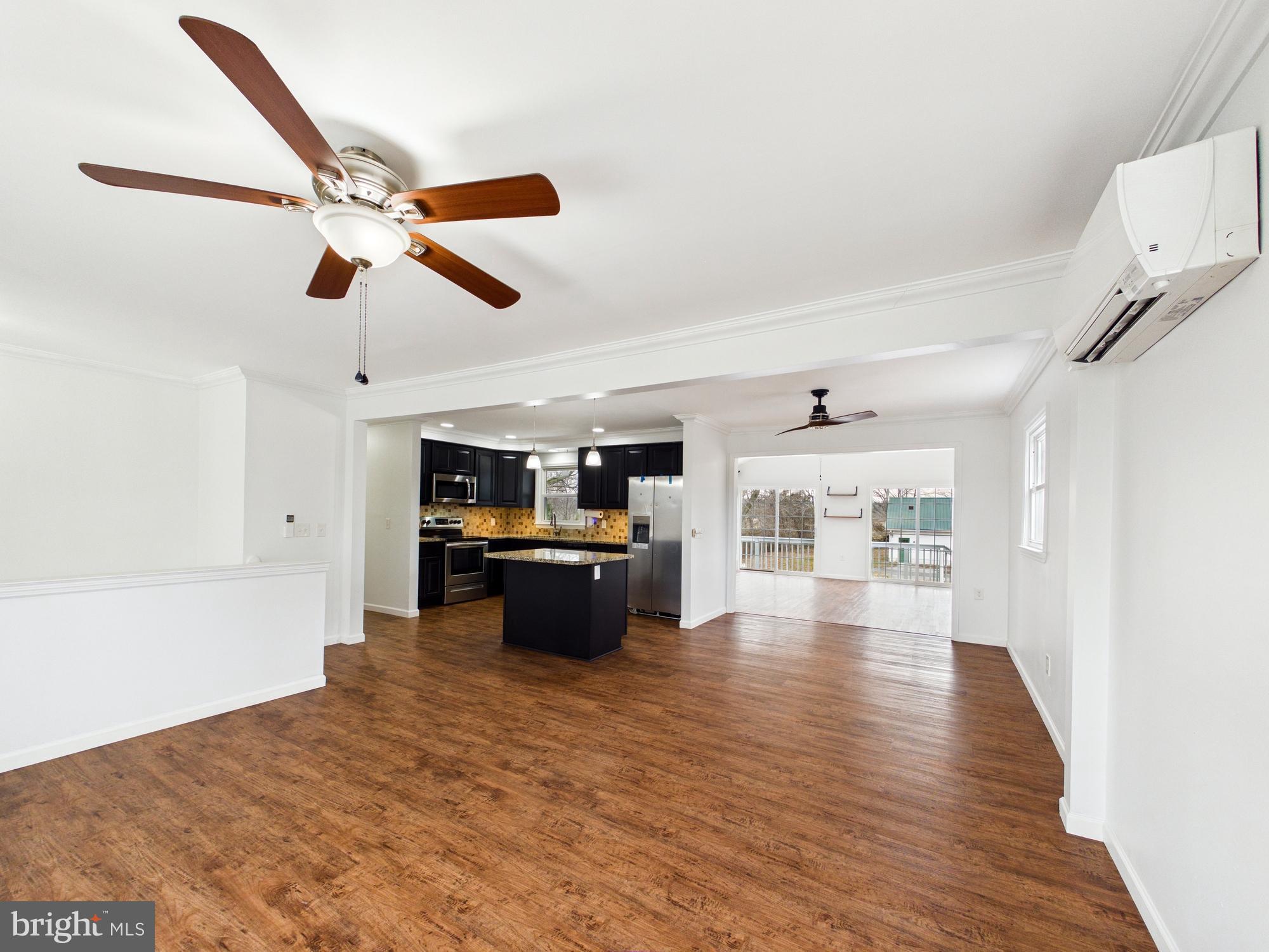 3231 Williamsville Road Houston, DE 19954 - Photo 11 of 64 Spacious open-concept living area with style.