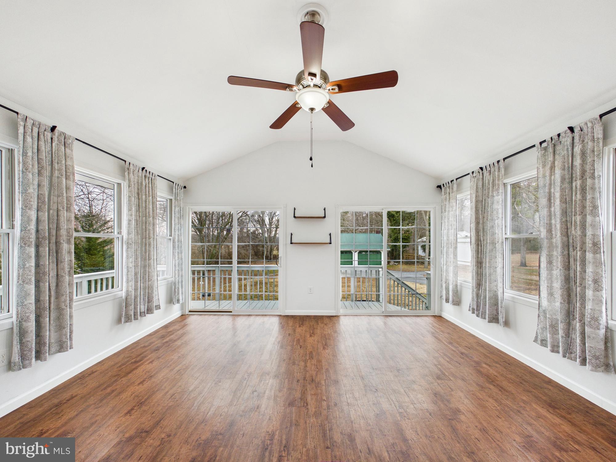 3231 Williamsville Road Houston, DE 19954 - Photo 12 of 64 Bright and airy sunroom with deck access