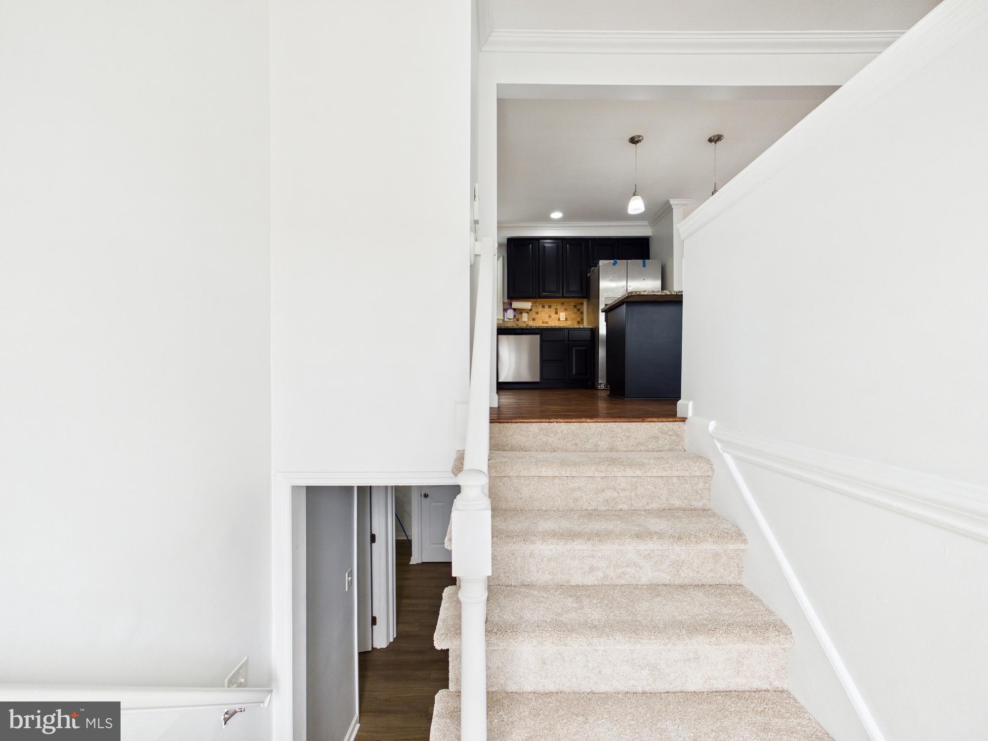 3231 Williamsville Road Houston, DE 19954 - Photo 4 of 64 Bright and inviting staircase to modern kitchen.