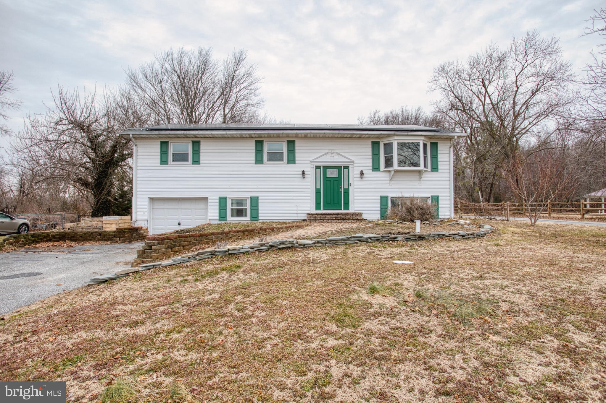 3231 Williamsville Road Houston, DE 19954 - Photo 59 of 64 Charming split-level home with green accents.