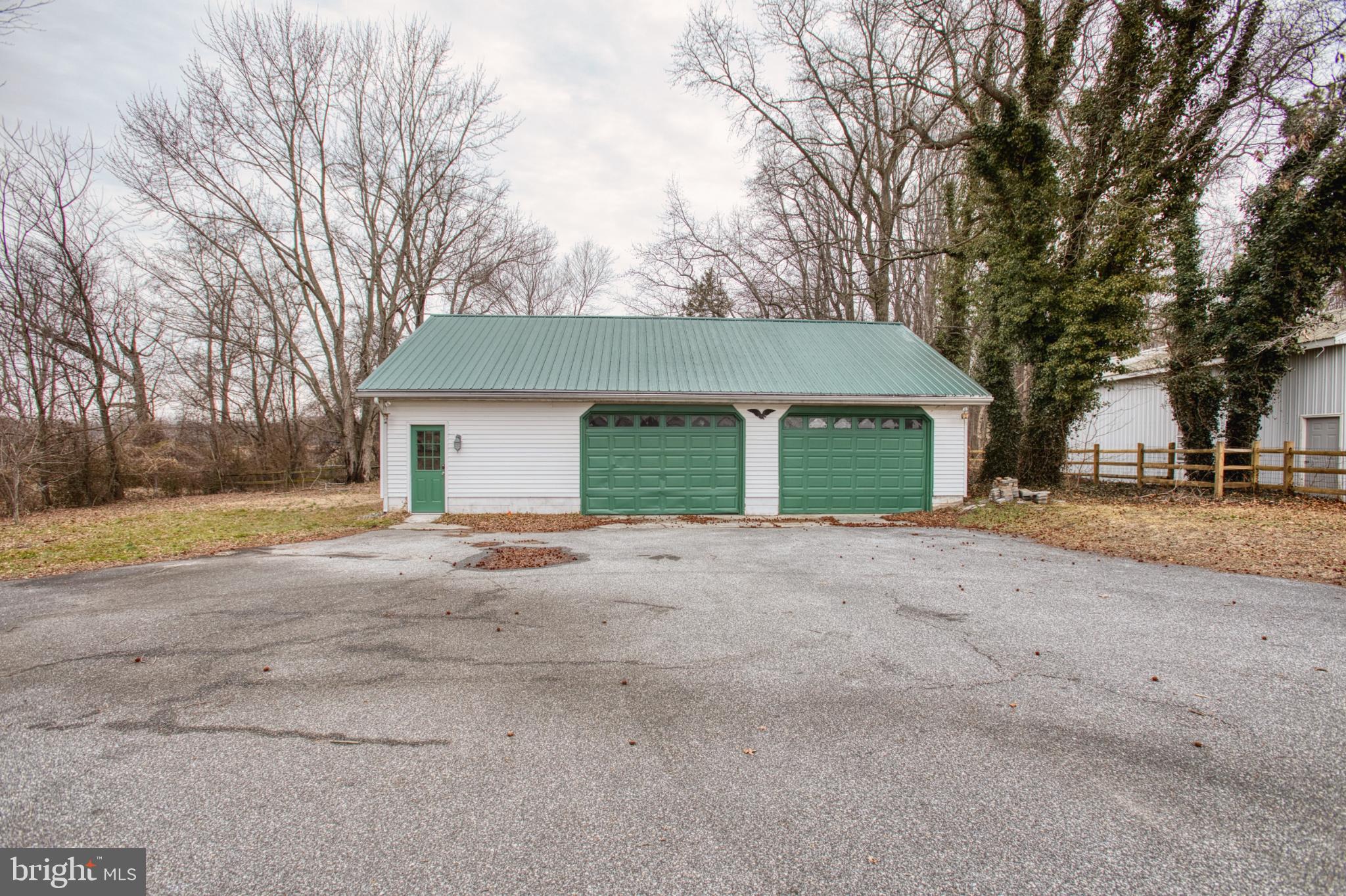 3231 Williamsville Road Houston, DE 19954 - Photo 60 of 64 Charming garage with green accents awaits!