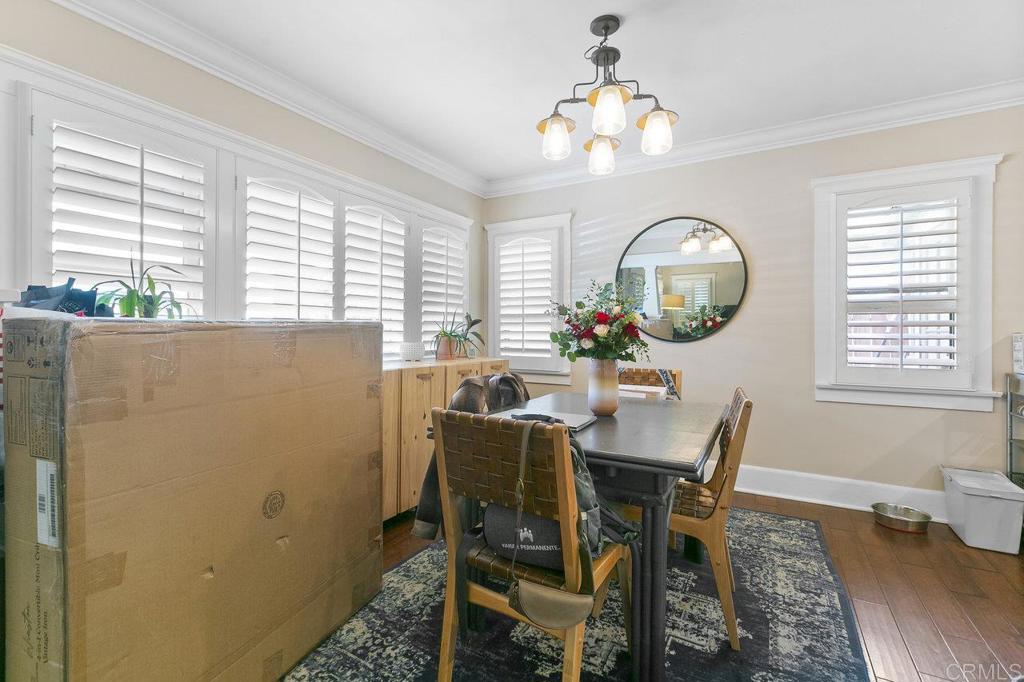 3373-3379 1/2 Herman Avenue San Diego, CA 92104 - Photo 13 of 70 a view of a dining room with furniture and a chandelier