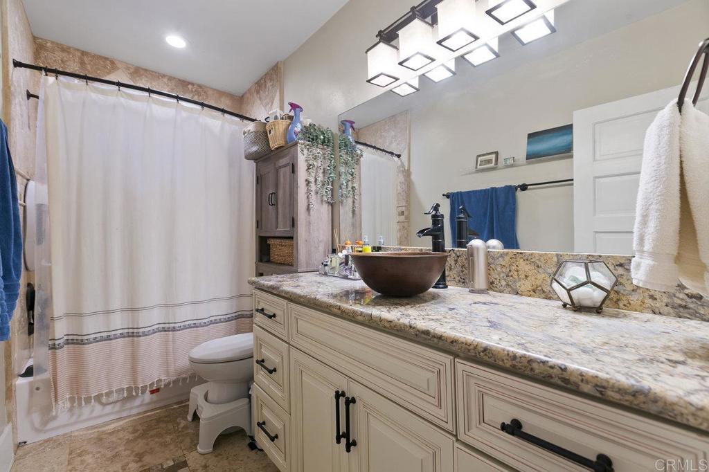 3373-3379 1/2 Herman Avenue San Diego, CA 92104 - Photo 19 of 70 a spacious bathroom with a granite countertop sink a toilet and a bathtub